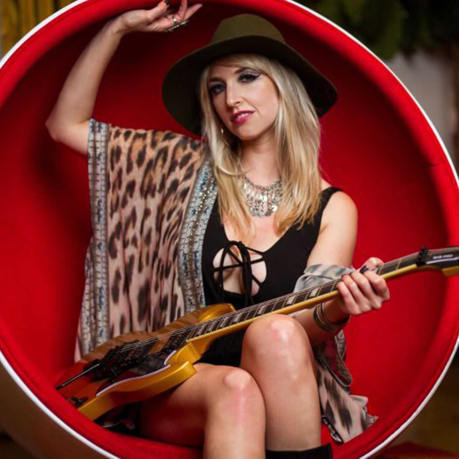 Britt Lightning Lead Guitarist for Vixen  Guest Mixologist for RockTails